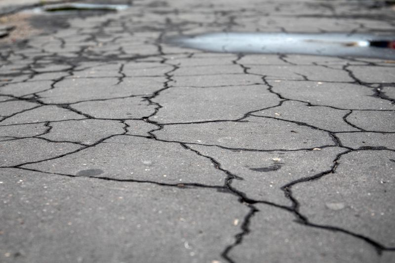Repair work on cracked pavement